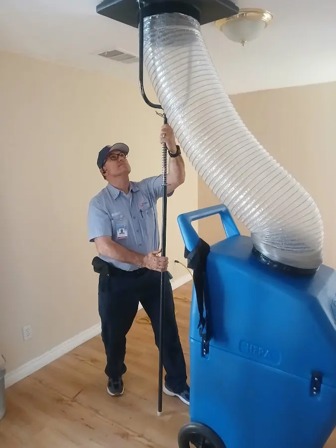 Furnace Tune-Up technician using HEPA equipment in Foothill Farms